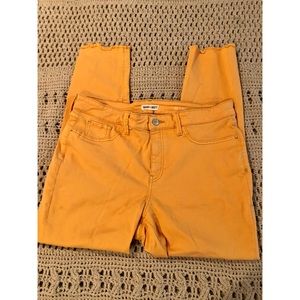 Stretchy mustard skinnies with a frayed edge